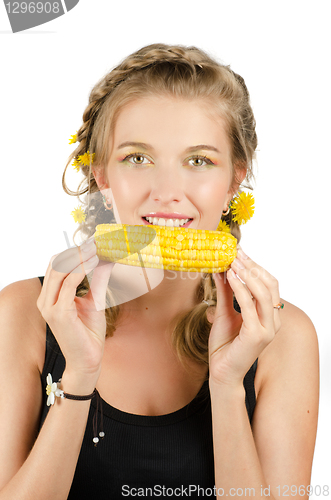 Image of woman eating corn-cob