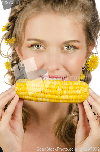 Image of woman eating corn-cob