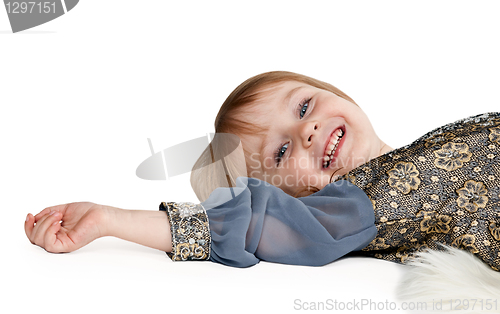 Image of little girl lying on the floor in the studio