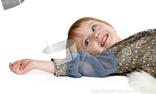 Image of little girl lying on the floor in the studio