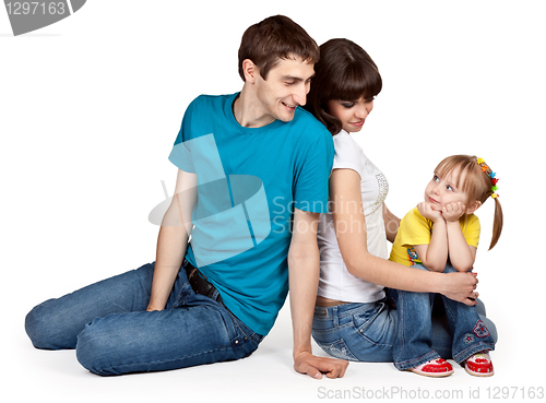 Image of father, mother and young daughter in jeans