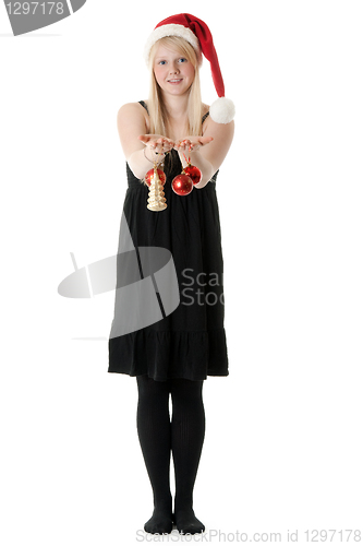 Image of Young beautiful girl in a Santa hat