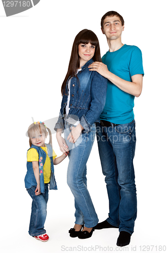 Image of father, mother and young daughter in jeans