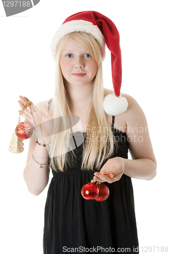 Image of Young beautiful girl in a Santa hat