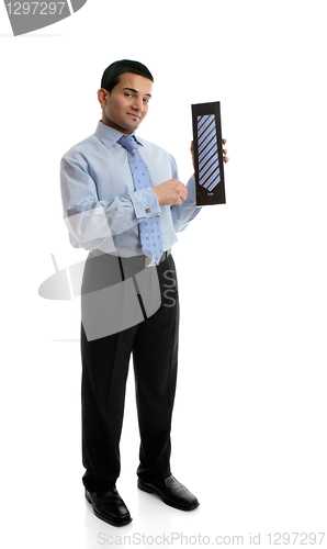 Image of Salesman holding a silk tie