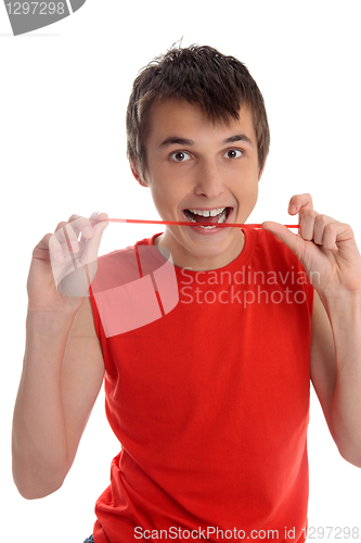 Image of Smiling boy eating candy