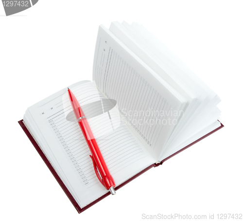 Image of Empty open diary and red ball point pen