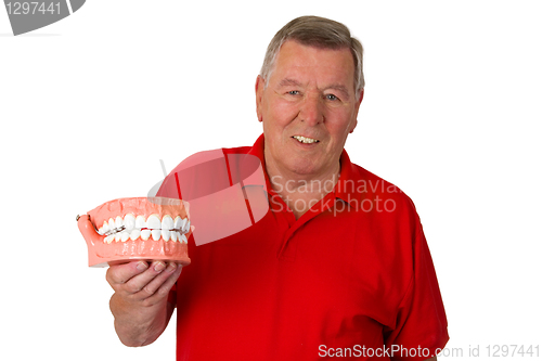 Image of Senior with teeth model