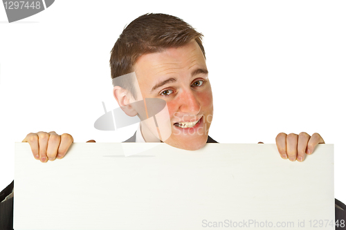 Image of Young businessman with white board