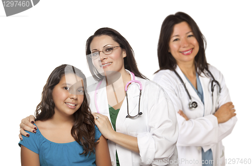 Image of Hispanic Female Doctor with Child Patient and Colleague Behind