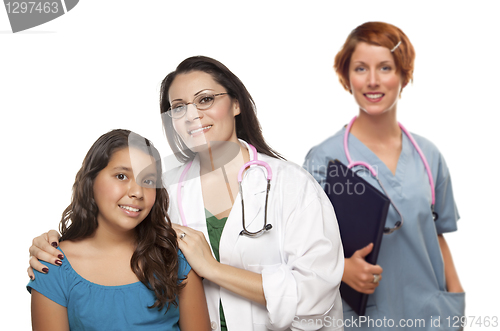 Image of Hispanic Female Doctor with Child Patient and Colleague Behind