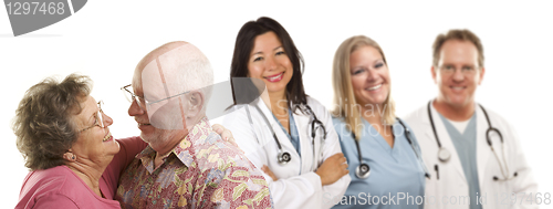 Image of Senior Couple with Medical Doctors or Nurses Behind