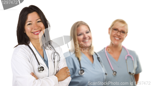 Image of Hispanic Female Doctor and Colleagues Behind