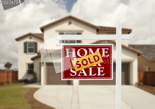 Image of Sold Real Estate Sign and House