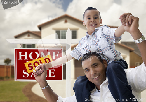 Image of Hispanic Father and Son in Front of House, Sold Sign