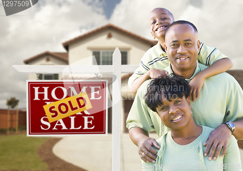 Image of African American Family, House and Sold Sign