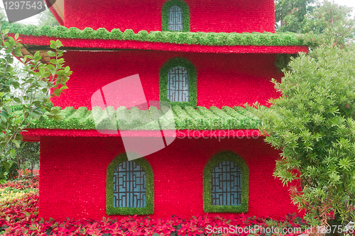Image of Chinese building model made of flowers