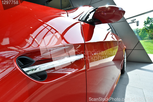 Image of side of red sports car