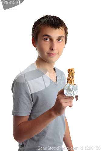 Image of Boy holding a nutritional snack bar