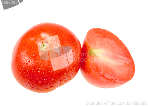 Image of Cross and full ripe red tomatoes with dew