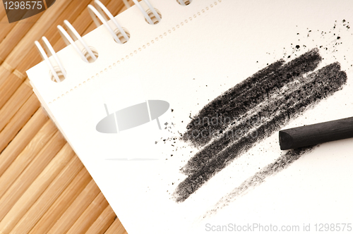 Image of Black charcoal with smudge