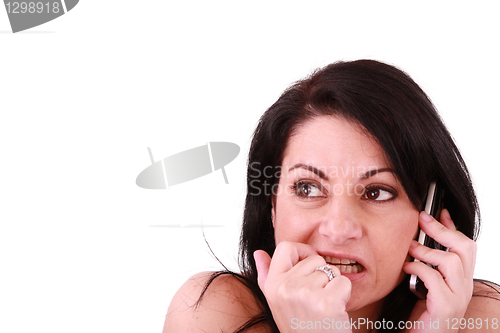 Image of afraid looking woman with a phone isolated on white 