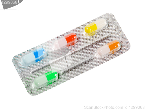 Image of One metallic blister with colorful pills