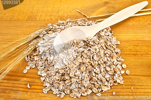 Image of Rye flakes with a spoon