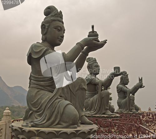 Image of Statues In Front Of Buddha In Hong Kong
