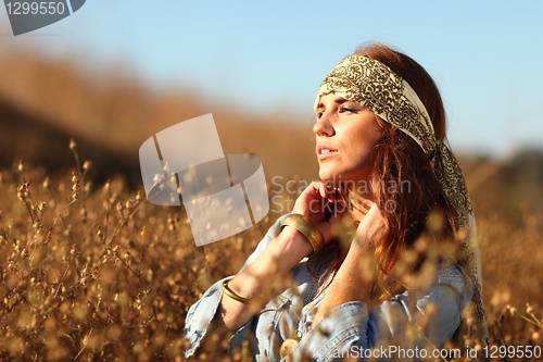 Image of Beautiful Woman on a Field in Summertime 