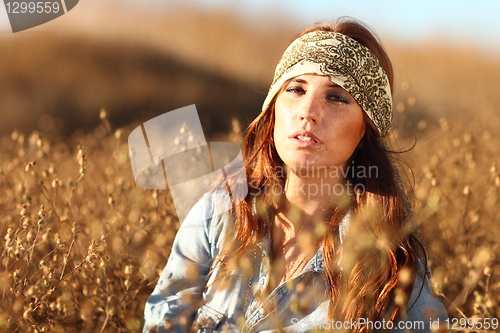 Image of Beautiful Woman on a Field in Summertime 