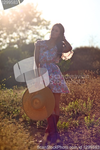 Image of Beautiful Woman on a Field in Summertime 
