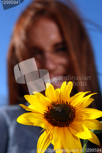 Image of Red Haired Woman Outdoors in a Sunflower Field