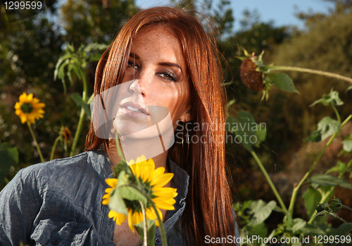 Image of Red Haired Woman Outdoors in a Sunflower Field
