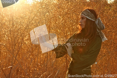 Image of Redhead Model Amongst Wheat Fields in the Warm Sun. Intentionall
