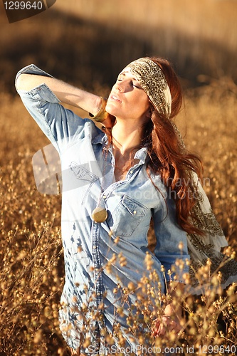Image of Beautiful Woman on a Field in Summertime 