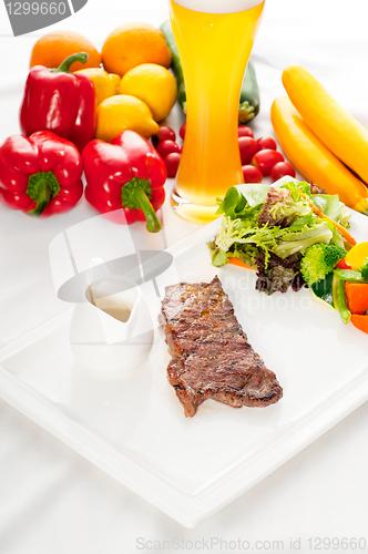 Image of juicy BBQ grilled rib eye ,ribeye steak and vegetables