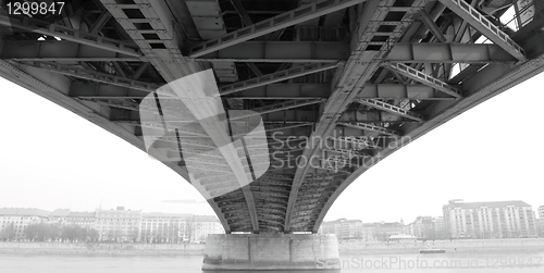 Image of abstract steel construction from under the bridge