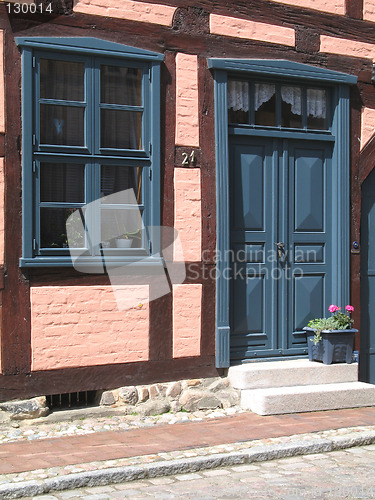 Image of pink half-timbered house