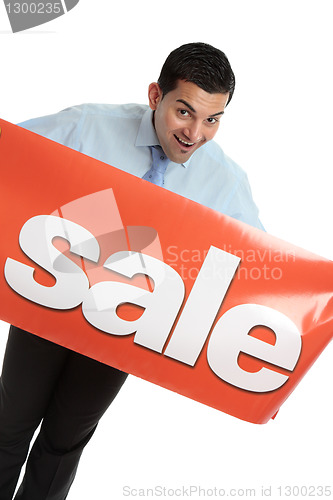 Image of Happy businesman or saleman with sale sign