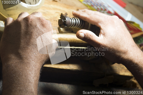 Image of hand rolling cigar production