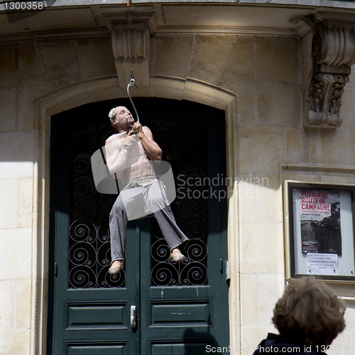 Image of Man hanged at a hook