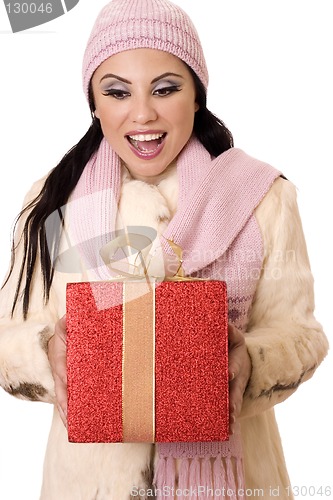 Image of Delightful Surprise - Female holding a large red and gold gift