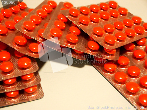 Image of red tablets in packing