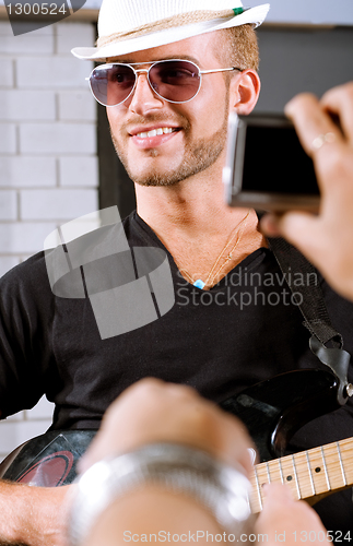 Image of Selective focus on guitarist in action