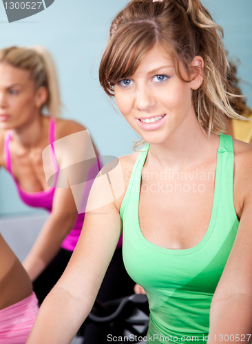 Image of Beautiful young girl spinning in a club