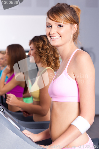Image of Group of women running on treadmill
