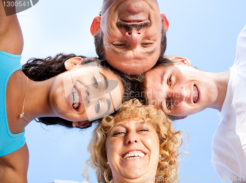 Image of Parents with kids having fun outdoors