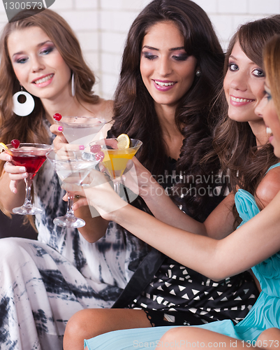 Image of Group of happy girls smiling and partying