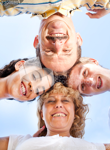 Image of Beautiful family. Heads together